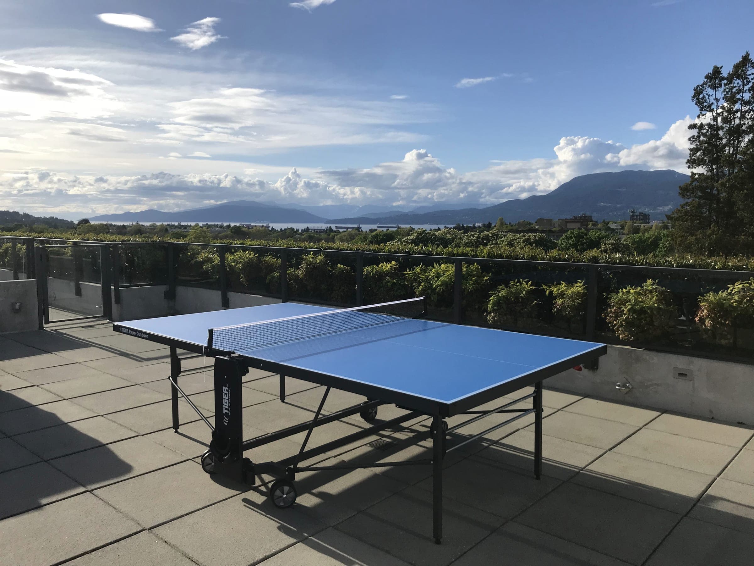 Blue Tiger Expo Outdoor table on a Vancouver terrace overlooking the water and North Shore mountains.
